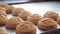 Ruddy buns lying on table in bakeryhouse.