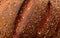 Ruddy crust of bread as an abstract background. Texture