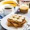 Ruddy toast with peanut butter, sliced â€‹â€‹bananas, coffee, br