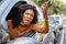 Rude black woman driver arguing and driving car