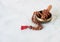 Rudra Japamala on a singing bowl on a white background. Meditation concept