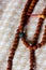 Rudraksha beads or rosary over a textile.