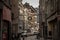 Rue du pont, a decaying street of the city center of Liege, with facade of old buildings