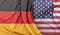 Ruffled Flags of Germany and USA. 3D Rendering