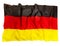 Ruffled Germany flag of silk, isolated on white
