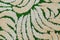 Rug texture with green line. Textile background with green pattern, carpet close up. Fabric texture with abstract semicircular