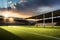 A rugby field bathed in golden sunlight during a match, with long shadows cast by the players