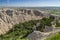 Rugged badlands with pine filled valley