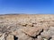 Rugged barren Egyptian desert landscape under a cloudless deep blue summer sky