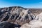 Rugged, barren, and heavily eroded desert mountain peaks in Petrified Forest National Park, Arizona