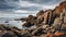 Rugged Beach With Sharp Boulders And Stormy Skies