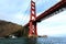 Rugged cliffs at end of Golden Gate Bridge span splashed with waves as tide goes out