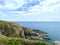 Rugged cliffs and rocky coastline at Marine Drive Isle of Man British Isles