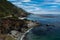 The rugged coastline of Big Sur, CA with the highway weaving and hugging the hills overlooking the ocean