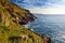 Rugged Cornish coastline at Porth Nanven on sunny evening, Cornwall, England