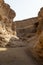 Rugged desert pathway winds through towering canyon walls in Namibia, Luderitz