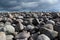 Rugged landscape large rounded boulders under low dark clouds