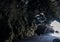 Rugged lava tunnel next to the Black sand beach on the Island of Maui in the State of Hawaii.