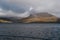 Rugged mountain peaks from a boat sailing along the coast