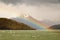 Rugged mountains and a rainbow on Seno de Ultima Esperanza, Patagonia, Chile