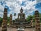 Ruin of ancient Statue and `don `t Climb `Sign in Wat mahathat Temple Area At sukhothai historical park,