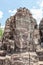 Ruin bayon stone face at gateway of Angkor Wat, Siem Reap, Cambodia.