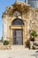 Ruin entrance door with lattice