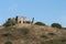 A ruin in the hills of the Tuscany landscape