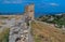 Ruin old ancient stone wall and tower of destroyed Genoese fortress in Feodosia made of white sand bricks