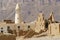 Ruin of an old mud brick fortress and a village mosque, near the city of Seiyun, Yemen