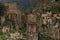 Ruin of old stone town on peak of in Caucasian mountains in Dagestan, fragments of destruction houses in medieval stone city.