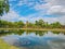 Ruin of Pagoda in Wat mahathat Temple Area and reflection in the water At sukhothai historical park