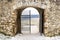 Ruin of Spissky Castle, Slovakia. View through a gate on countryside