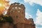 A ruin of stone tower of Heidelberg Castle in sunshine in the evening.