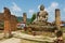 Ruin of the Wat Phia Wat temple with damaged Buddha statue in Phonsavan, Laos.