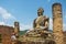 Ruin of the Wat Phia Wat temple with damaged Buddha statue in Phonsavan, Laos.