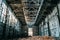 Ruined and abandoned industrial factory warehouse hangar with perspective view