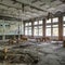 Ruined assembly hall with debris in abandoned Pripyat school