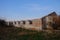 A ruined barn on an abandoned livestock farm