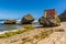 A ruined building on a wave-cut boulder on the shore of Bathsheba Beach on the Atlantic coast of Barbados