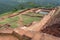Ruined city on ancient Sigiriya rock with archeological area and pool, Sri Lanka. UNESCO world heritage site from 1982