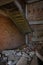 A ruined, crumbling staircase in an abandoned building.