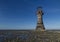 Ruined derelict lighthouse, space to top left. Whiteford Sands,