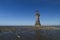 Ruined derelict lighthouse, space to top left. Whiteford Sands,