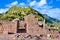Ruined door of ancient Pisac inca town in Peru Sacred valley
