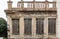 Ruined facade of an abandoned neoclassical building in old town of Plaka, Athens, Greece