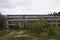 ruined industrial building on stilts with a broken wall of glass fragments. A picture of desolation and destruction