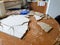 Ruined kitchen by collapsed ceiling.