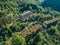 Ruined lost overgrown mining ghost town Akarmara, consequences of war in Abkhazia, aerial view from drone