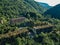 Ruined lost overgrown mining ghost town Akarmara, consequences of war in Abkhazia, aerial view from drone